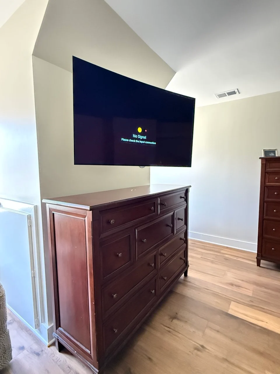 corner tv wall mounting installation above dresser with full motion mount Atlanta