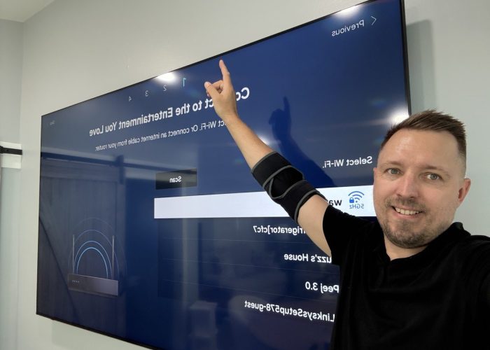 a man pointing at a screen